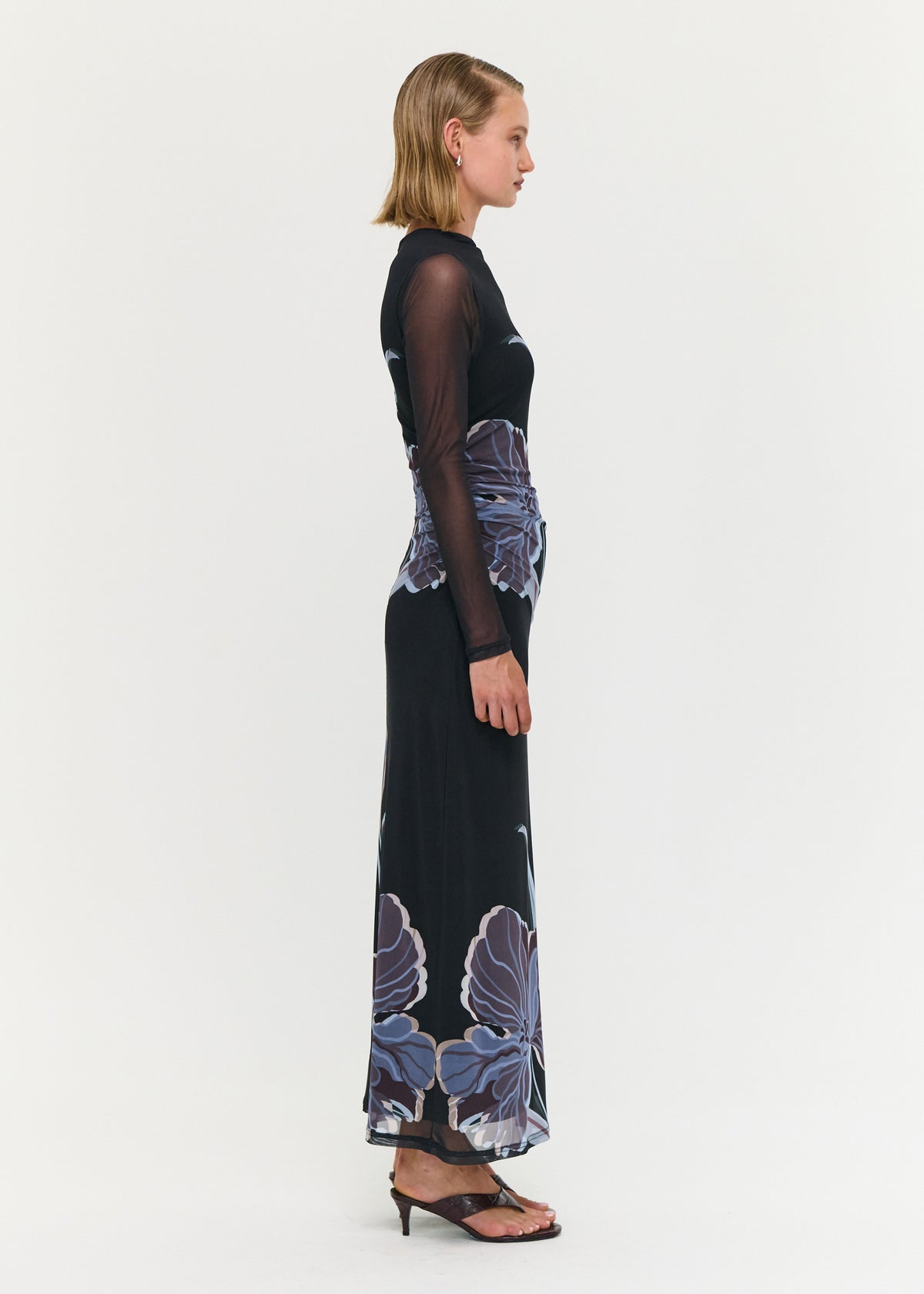 Side view of the Blue Floral Mesh Midi Dress, showing a sheer mesh fabrication and a fitted silhouette.
