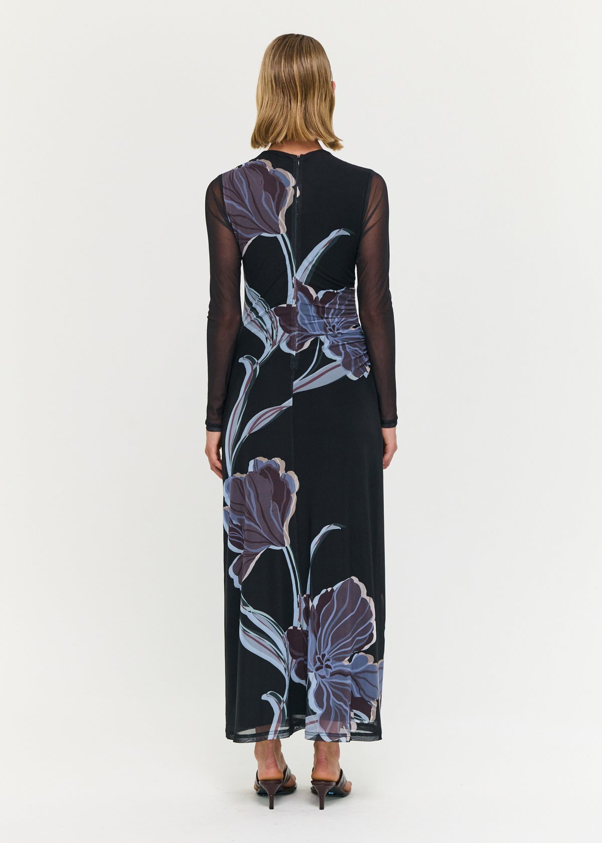 Back view of the Blue Floral Mesh Midi Dress with a sheer mesh fabrication and a fitted silhouette.