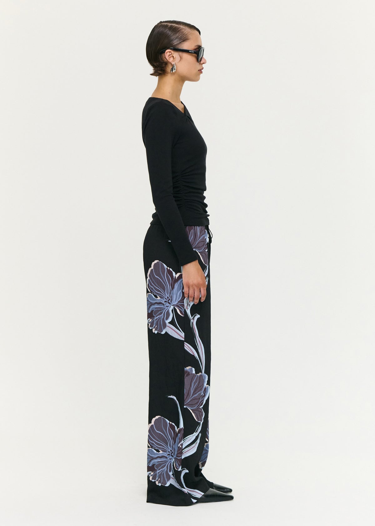 Side view of the Blue Floral Relaxed Drawstring Pant, showing an elasticated waistband with drawstring and side pockets.