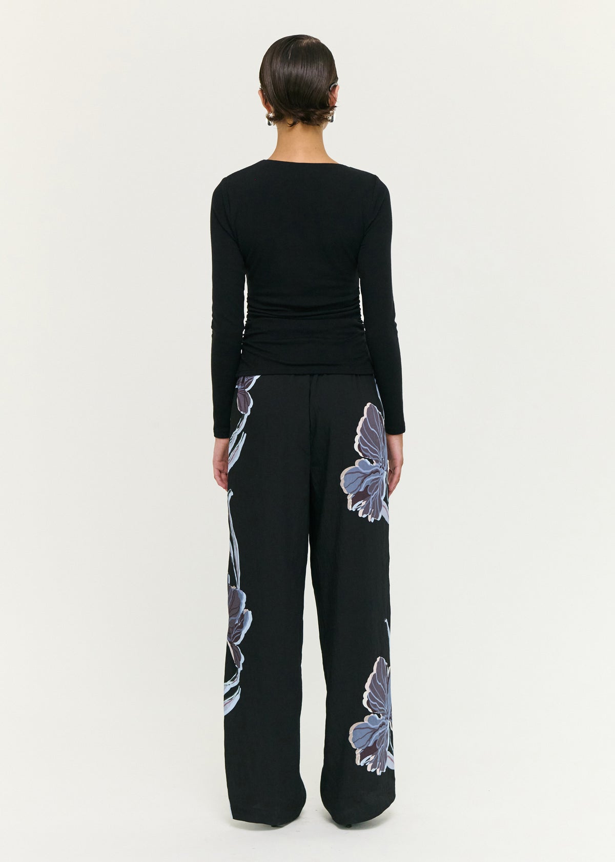 Back view of the Blue Floral Relaxed Drawstring Pant with a lightweight woven fabrication and a relaxed wide leg silhouette.