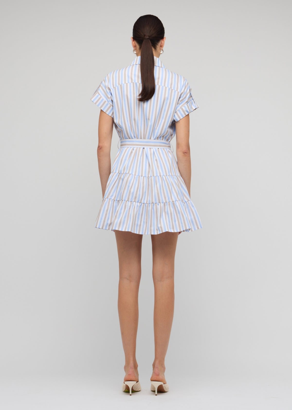Back view of the Blue Stripe Cotton Mini Shirt Dress with a button-down front and an adjustable waist tie.