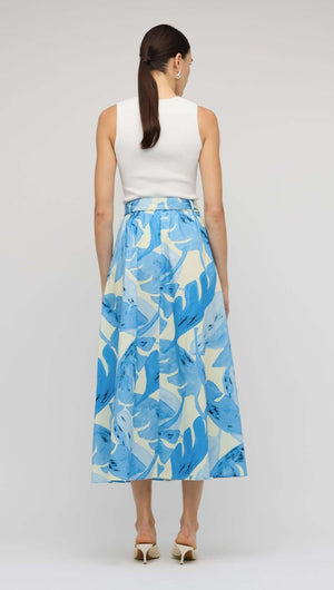 Blue & White Floral Cotton A-Line Maxi Skirt displayed from the back with a white top and stylish self-tie belt.