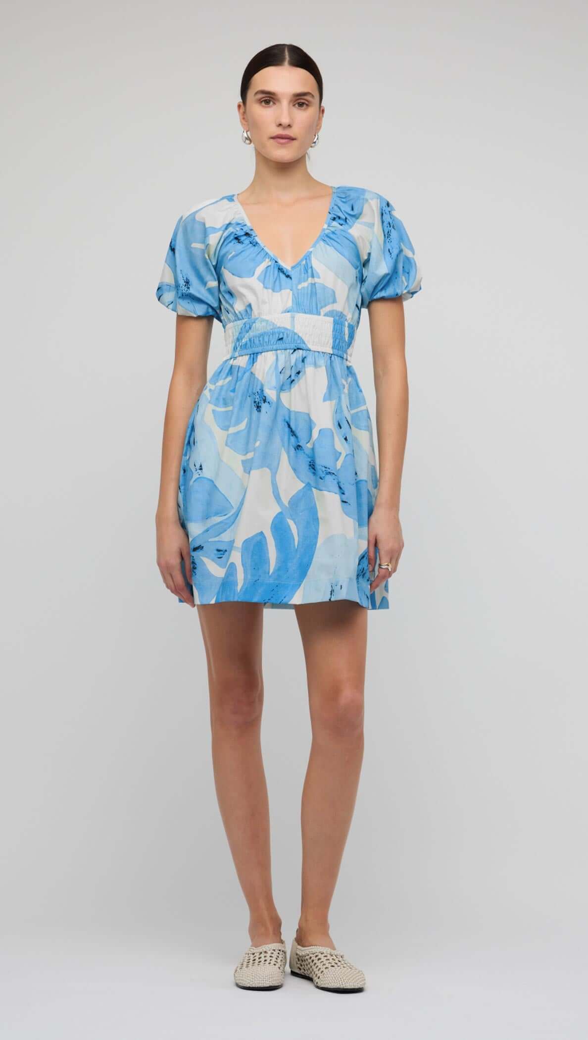 Blue & White Floral Cotton V-Neck Mini Dress showcasing a lightweight design with puff sleeves and a flattering silhouette.