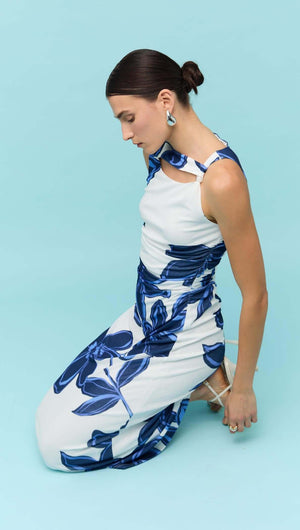 Model wearing a Blue & White Floral Mesh Midi Dress by Staple the Label against a light blue background.