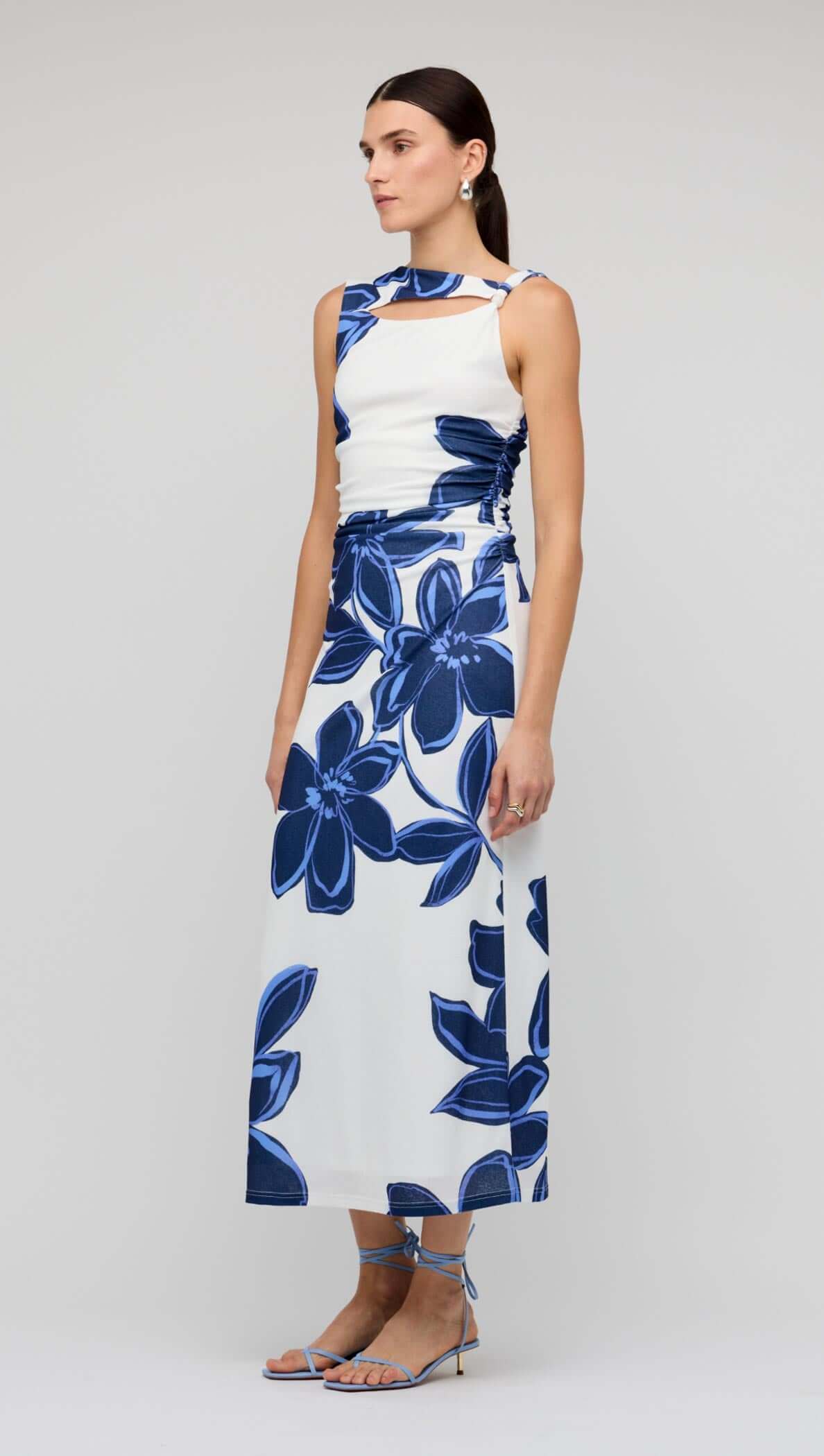 Blue & White Floral Mesh Midi Dress worn by a model, showcasing bold floral print and sleeveless design.