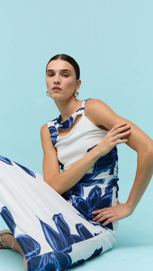 Model wearing a Blue & White Floral Mesh Midi Dress with oversized floral print and cut-out detail.