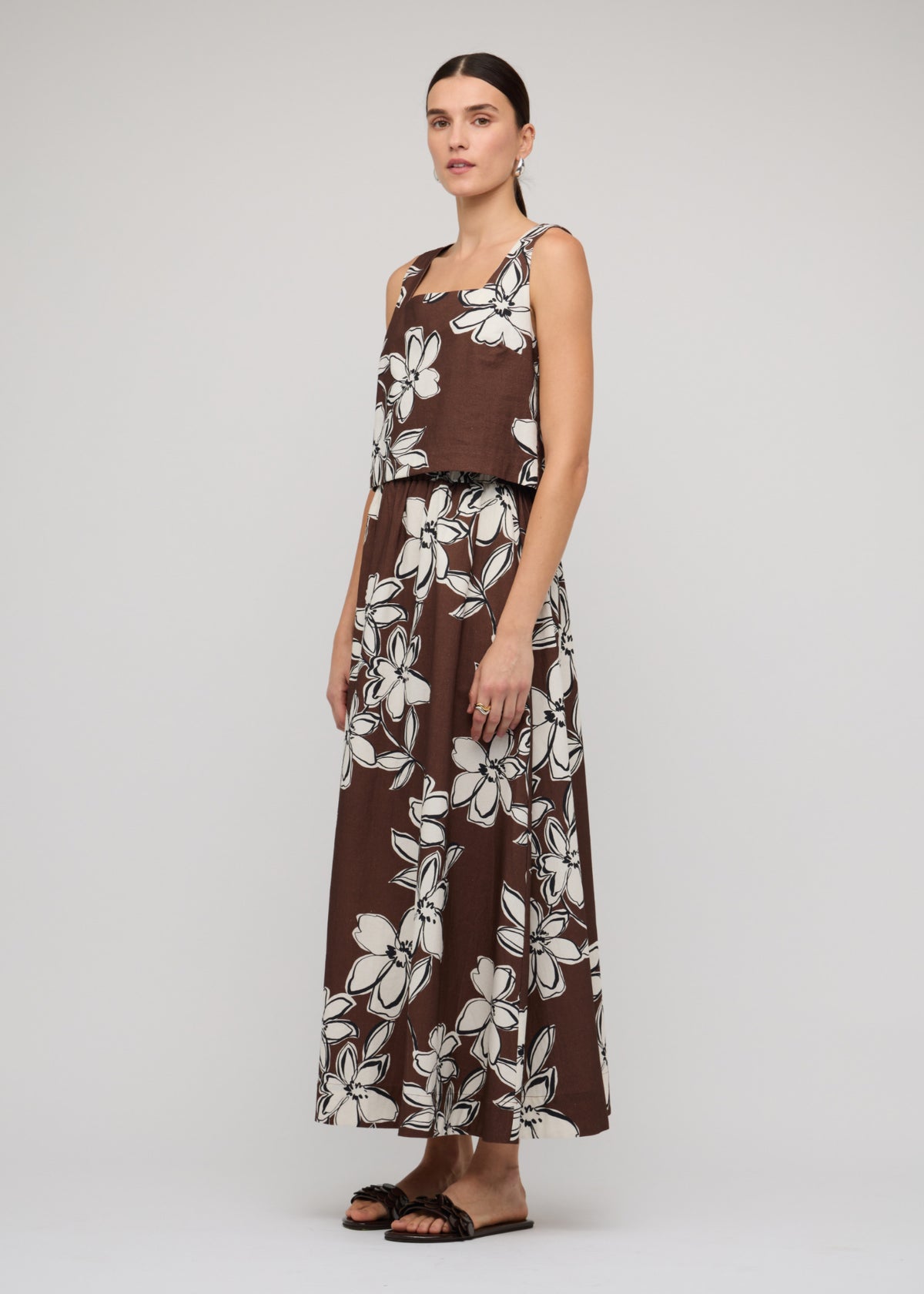 Model wearing Brown and White Cotton Floral Crop Top with a chocolate brown with white floral print and a square neckline.