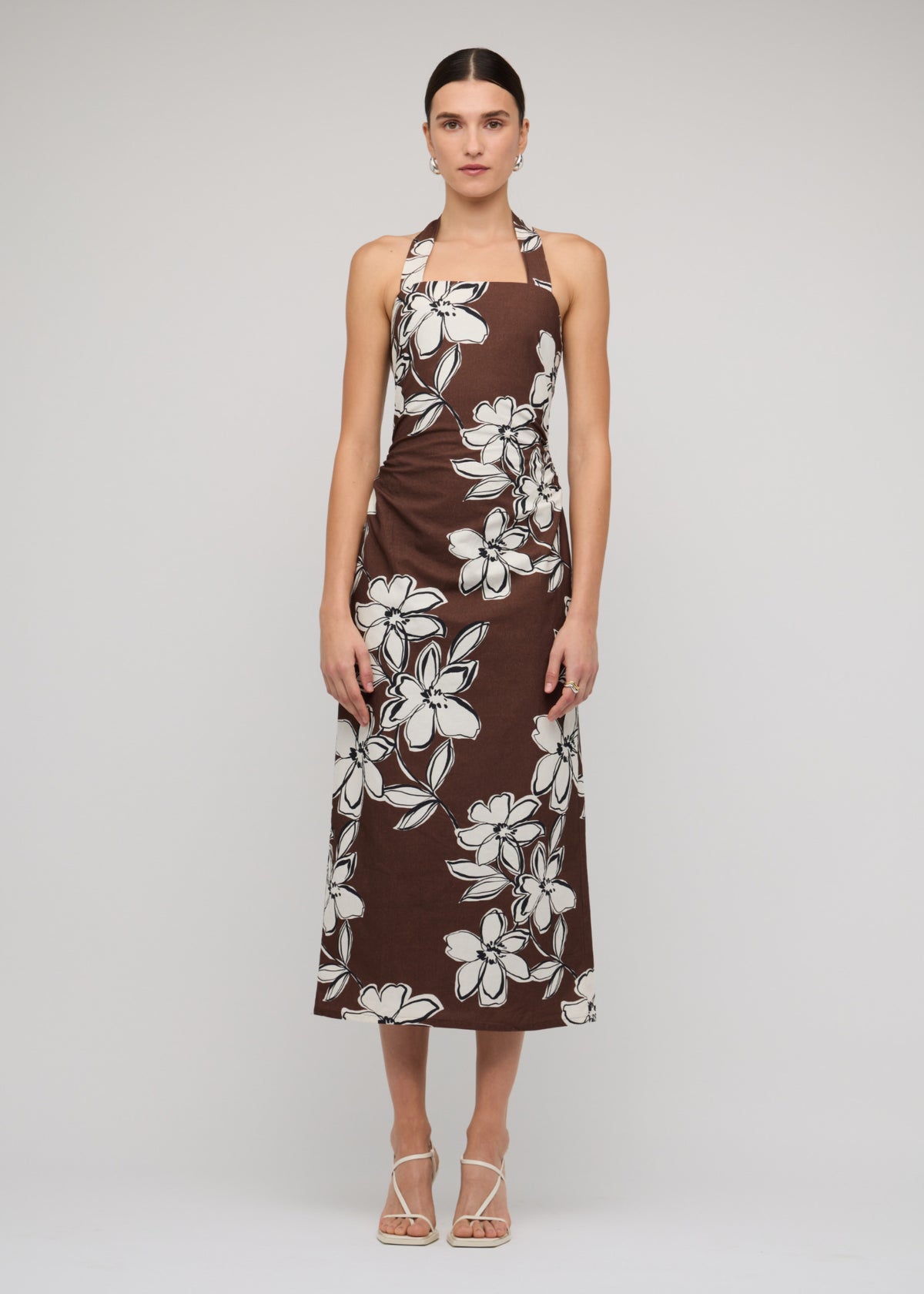 Model wearing Brown and White Cotton Floral Halter-Neck Midi Dress with a chocolate brown with white floral print.