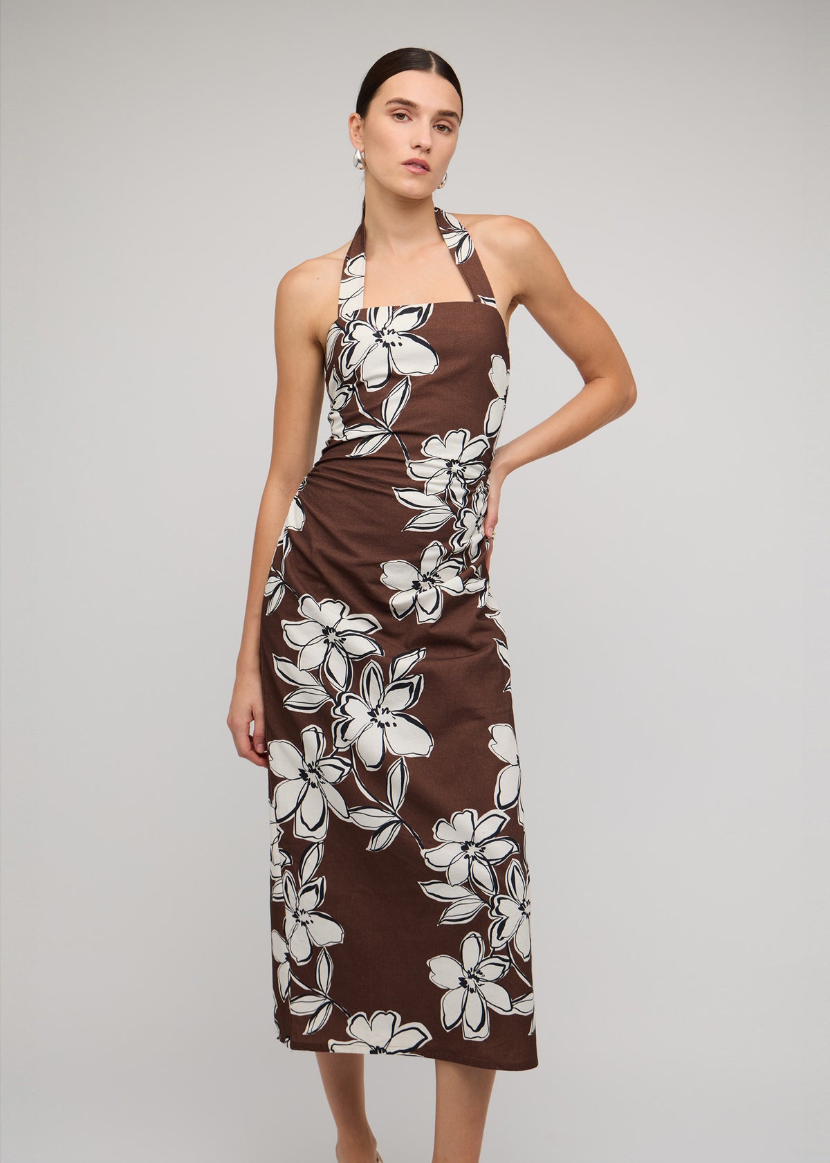 Close-up of the Brown and White Cotton Floral Halter-Neck Midi Dress, showing a chocolate brown with white floral print.