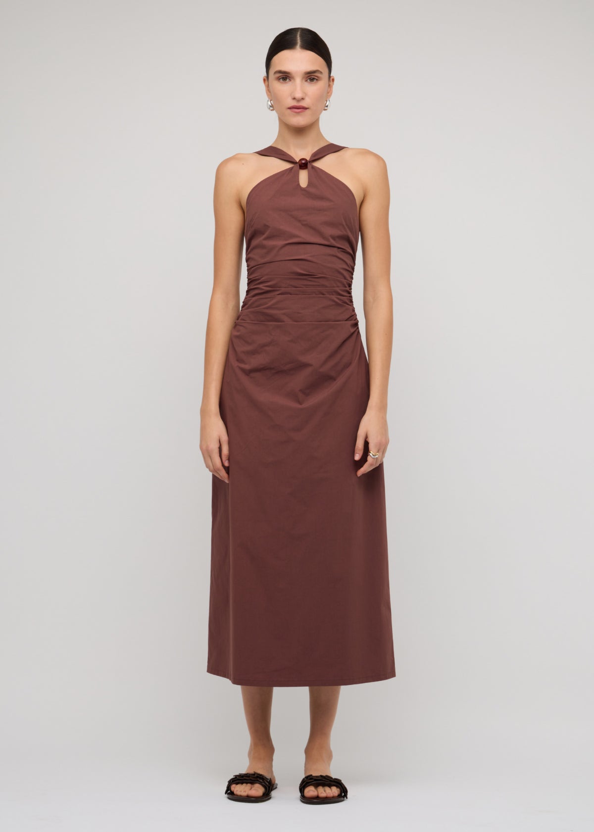 Model wearing Brown Cotton Bead Halter-Neck Ruched Midi Dress with a 100% Cotton and a halter neckline with bead detail.