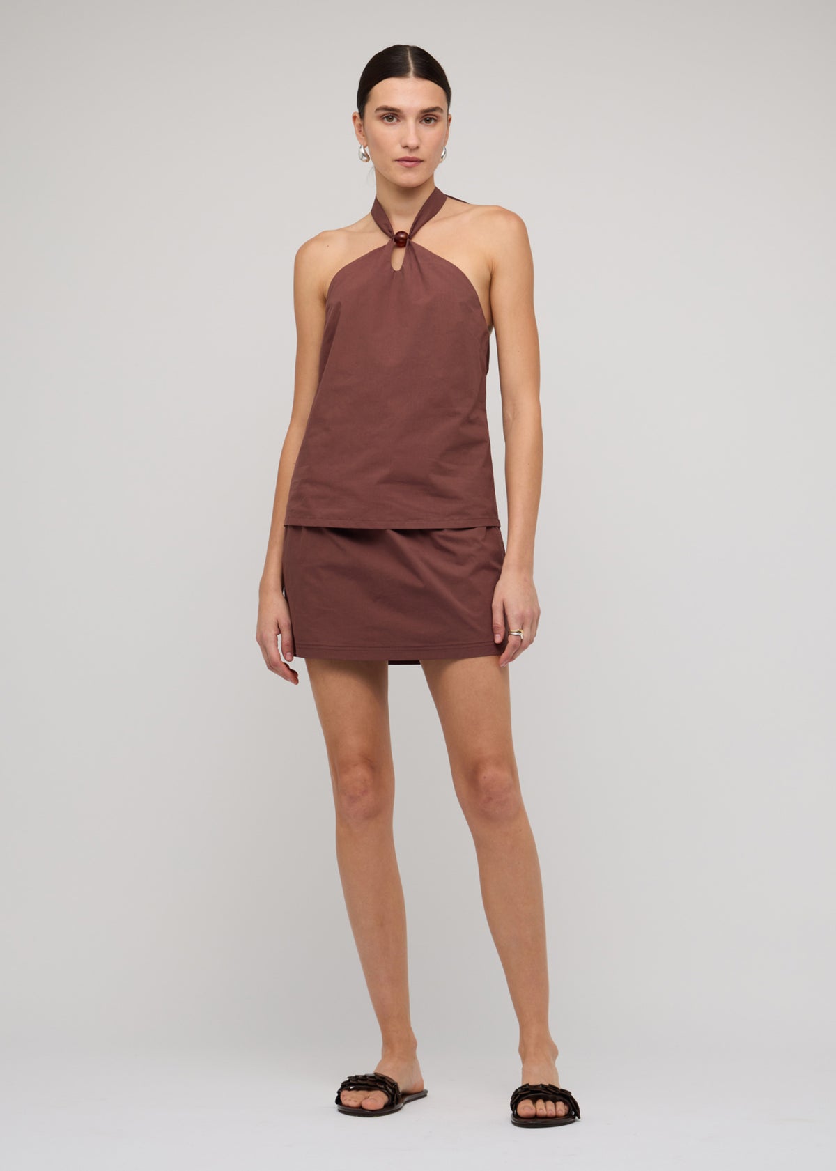 Model wearing Brown Cotton Bead Halter-Neck Top, showing an adjustable tie-back fastening and a chocolate brown colourway.