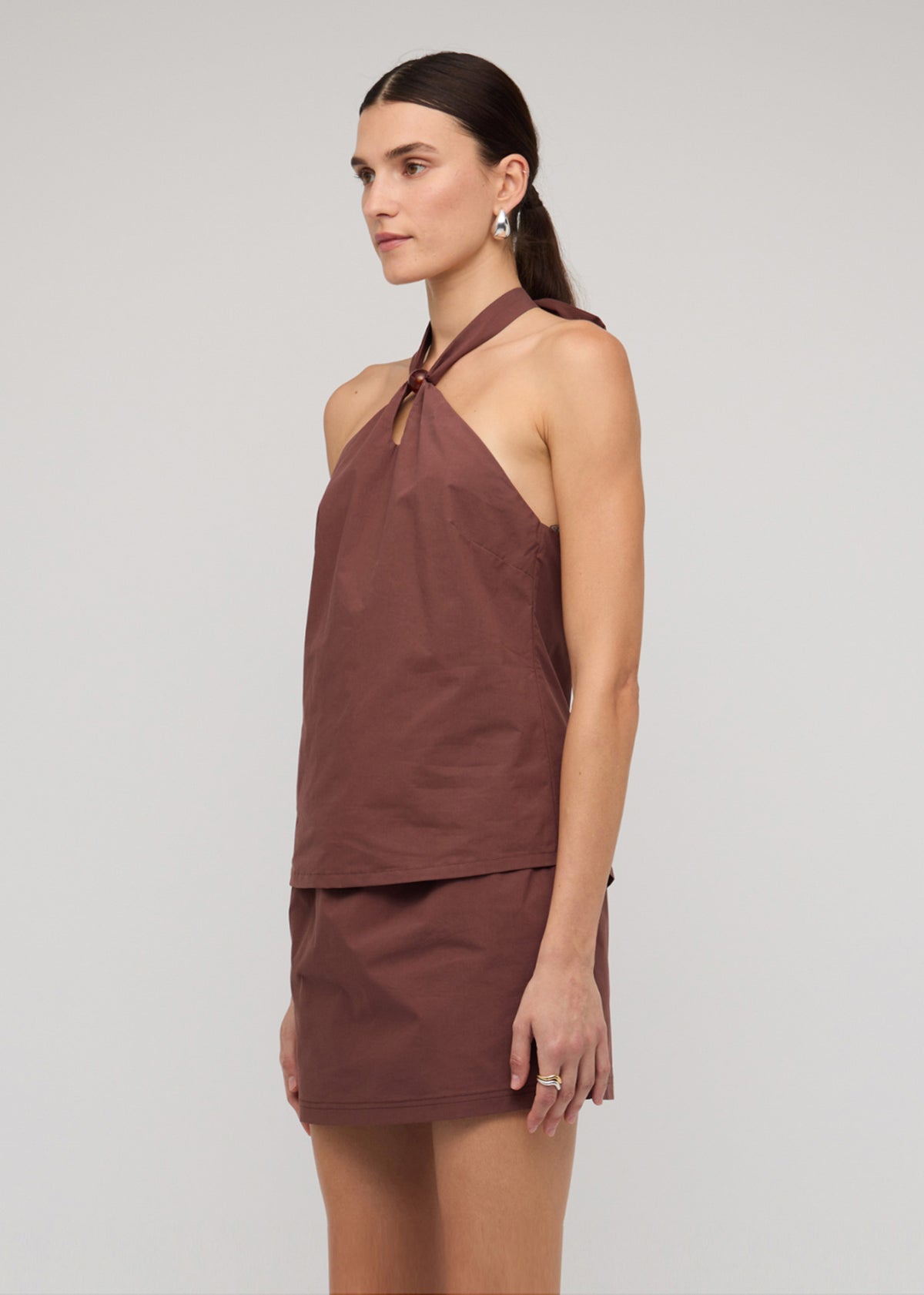 Close-up of the Brown Cotton Bead Halter-Neck Top, showing a halter neck with ring detail and an adjustable tie-back fastening.