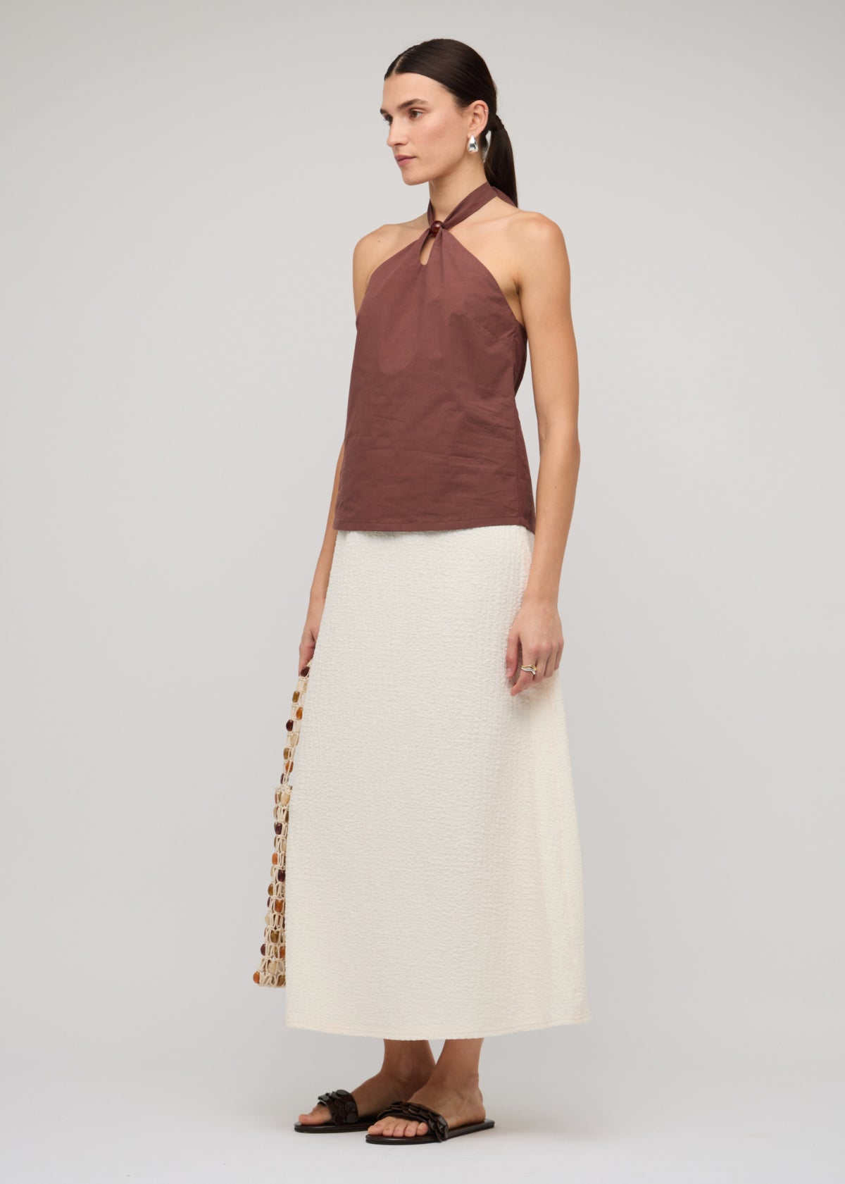 Side view of the Brown Cotton Bead Halter-Neck Top, showing a 100% Cotton and a halter neck with ring detail.