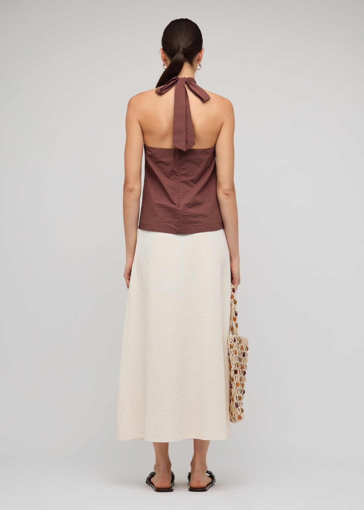 Back view of the Brown Cotton Bead Halter-Neck Top, showing an adjustable tie-back fastening and a 100% Cotton.
