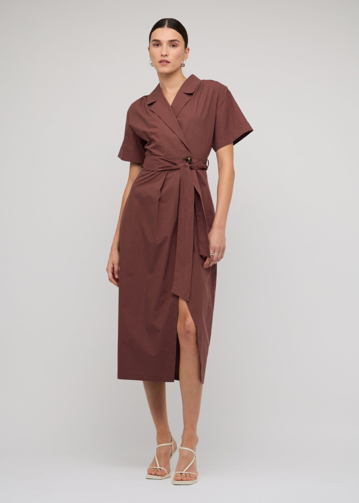 Model wearing Brown Cotton Wrap Midi Shirt Dress with a 100% Cotton and a midi length.
