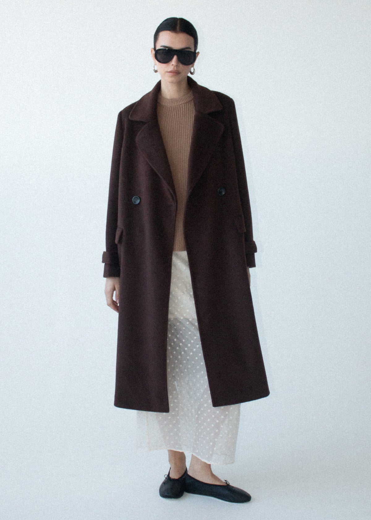Model wearing Brown Double-Breasted Longline Coat with a longline length and a rich chocolate brown tone.