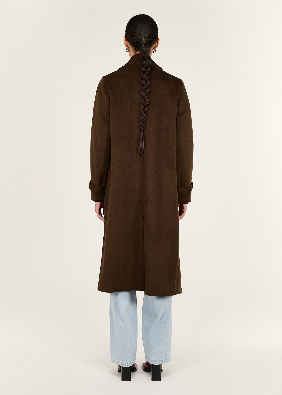 Back view of the Brown Double-Breasted Longline Coat, showing a back vent and a soft brushed woven fabrication.