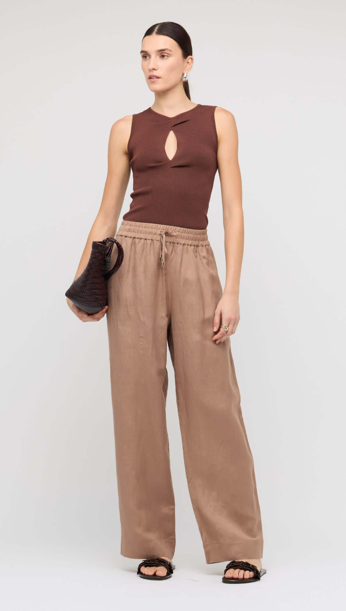 Brown Relaxed Wide-Leg Linen Pants styled with a brown top and handbag, perfect for casual wear.