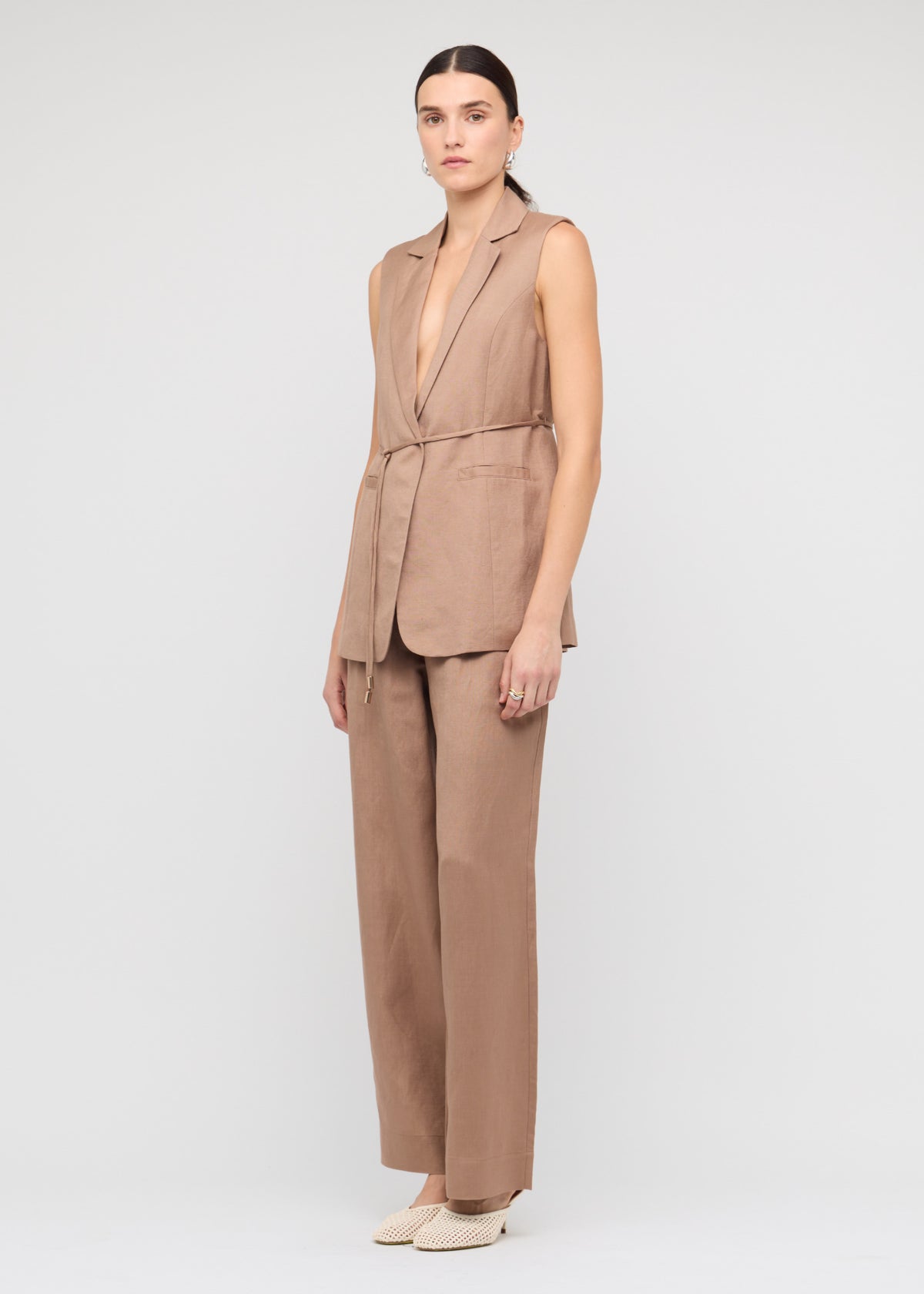 Model wearing Brown Relaxed Wide-Leg Linen Pants with an elastic waistband with drawstring tie and a wide-leg silhouette.