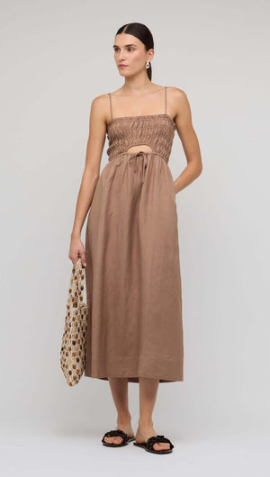 Brown Shirred Cut-Out Linen Midi Dress showcased on a model with adjustable straps and flowy skirt, perfect for summer.