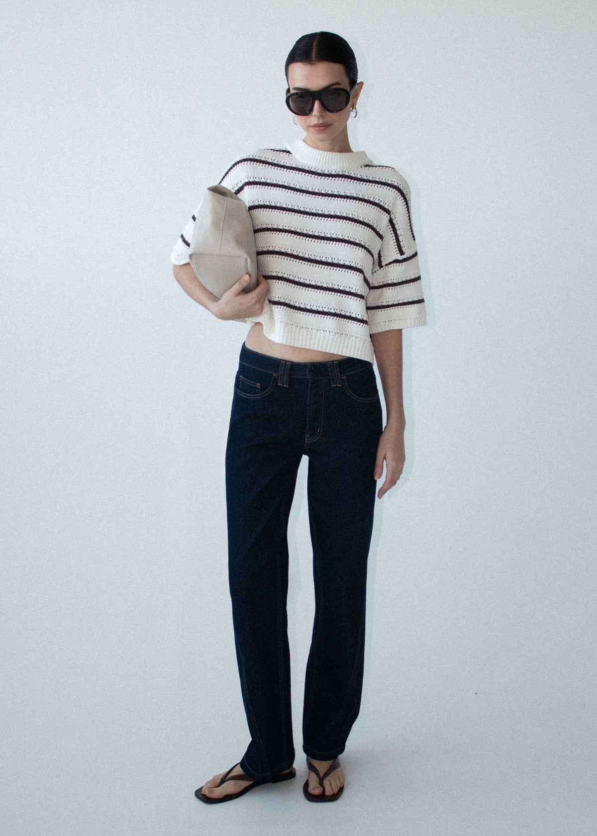 Model wearing Brown Stripe Cotton Blend Crew Knit Tee, showing a round neckline and dropped shoulders.