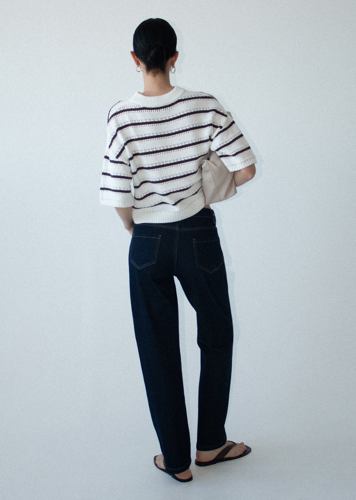 Back view of the Brown Stripe Cotton Blend Crew Knit Tee with an open-stitch knit fabrication and a contrast stripe detail.