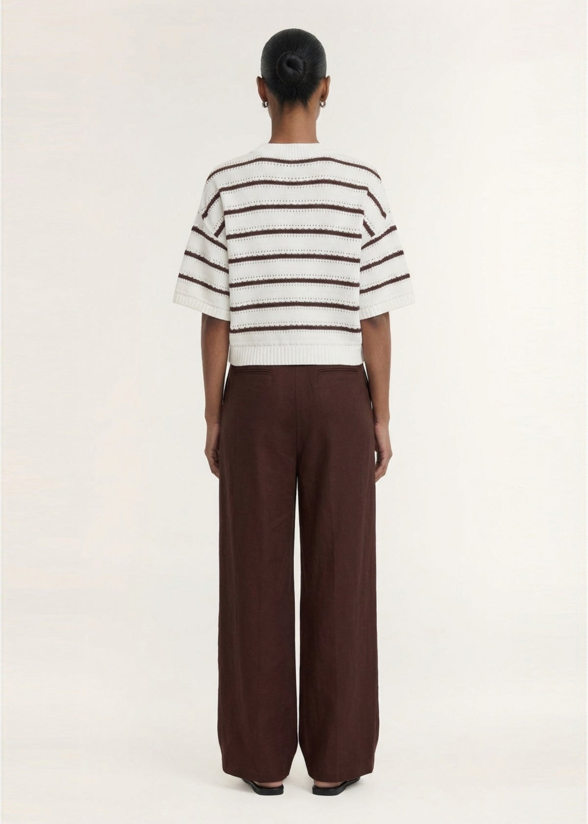 Back view of the Brown Stripe Cotton Blend Crew Knit Tee, showing an open-stitch knit fabrication and a contrast stripe detail.