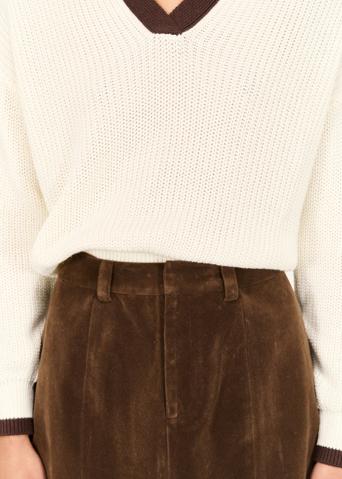 Close-up detail of the Brown Vegan Suede Mini Skirt, showing waistband and belt loops.