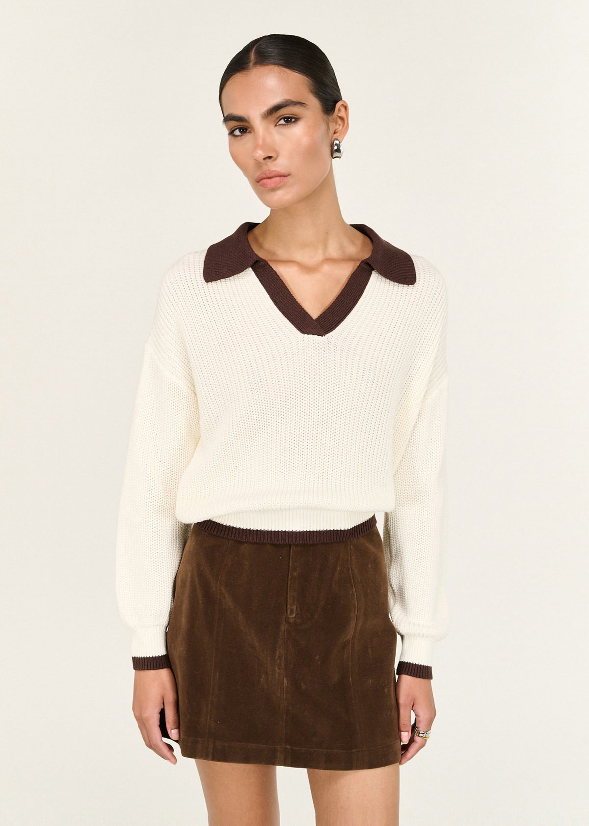 Close-up of the Brown Vegan Suede Mini Skirt, showing a vegan suede texture and a structured waistband.