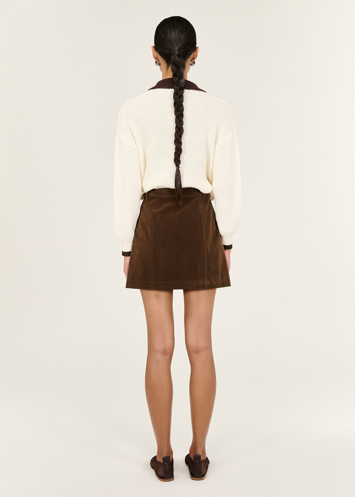 Back view of the Brown Vegan Suede Mini Skirt with a vegan suede texture and a structured waistband.