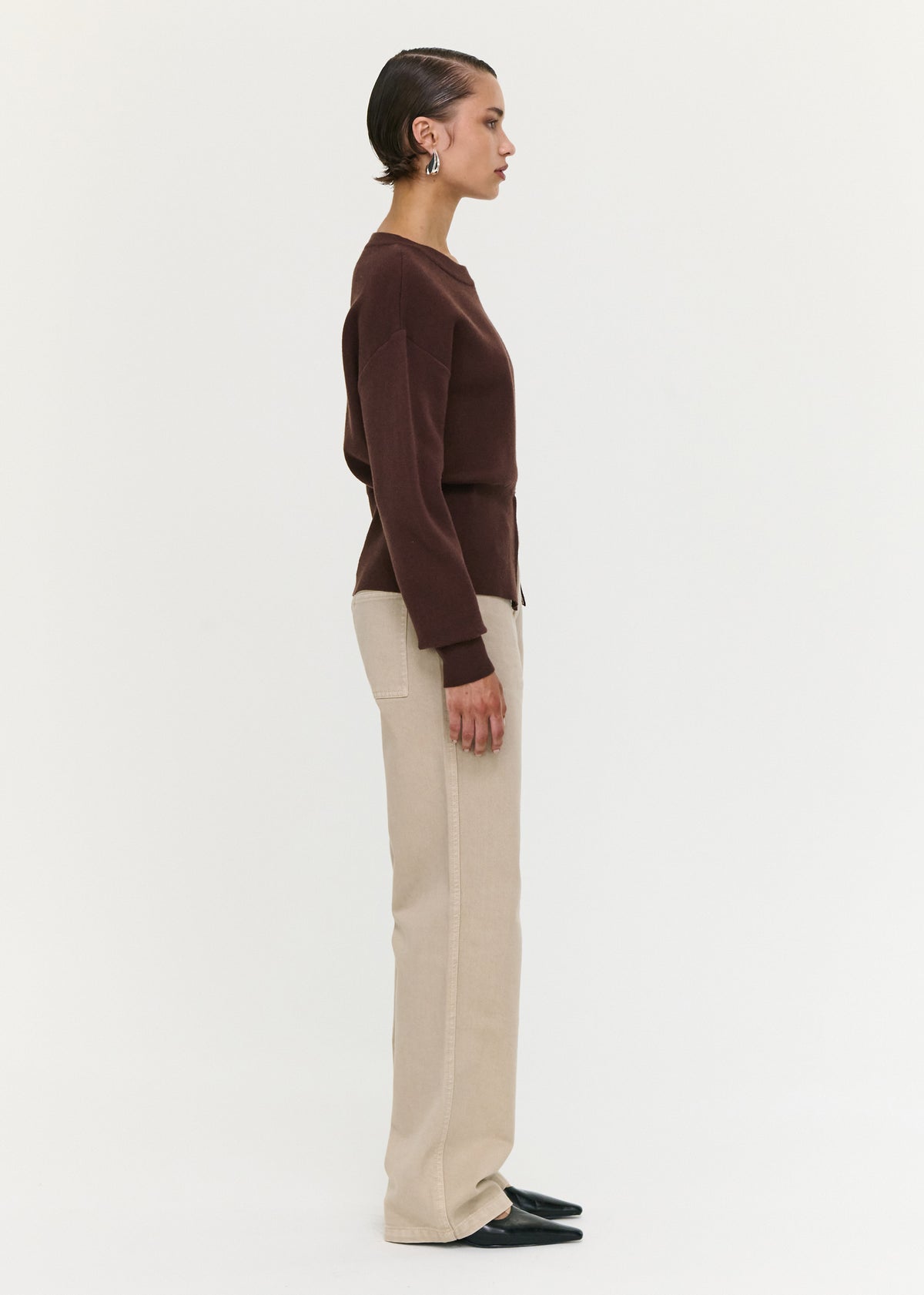 Side view of the Brown Zip Detail Soft Crew Neck Knit, showing a soft knit fabrication and a crew neckline.
