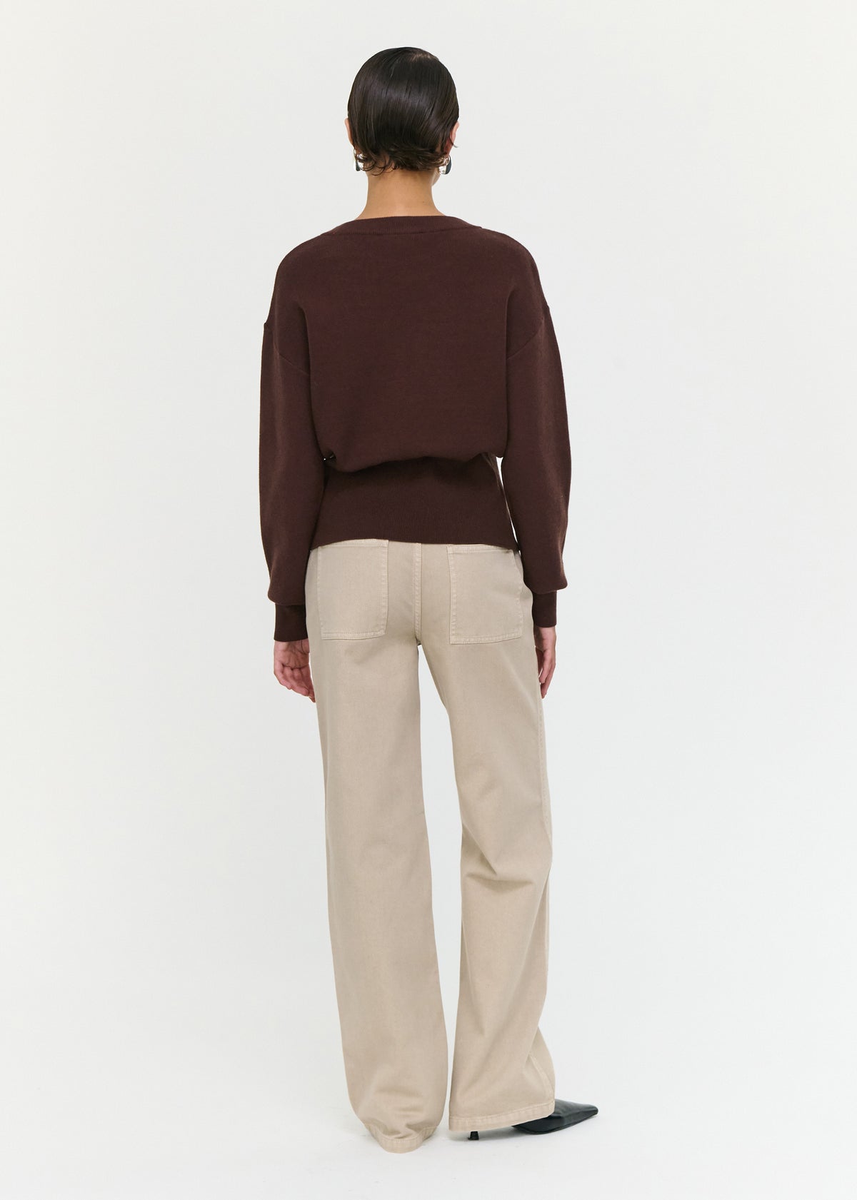Back view of the Brown Zip Detail Soft Crew Neck Knit with a front zip split detail and a soft knit fabrication.
