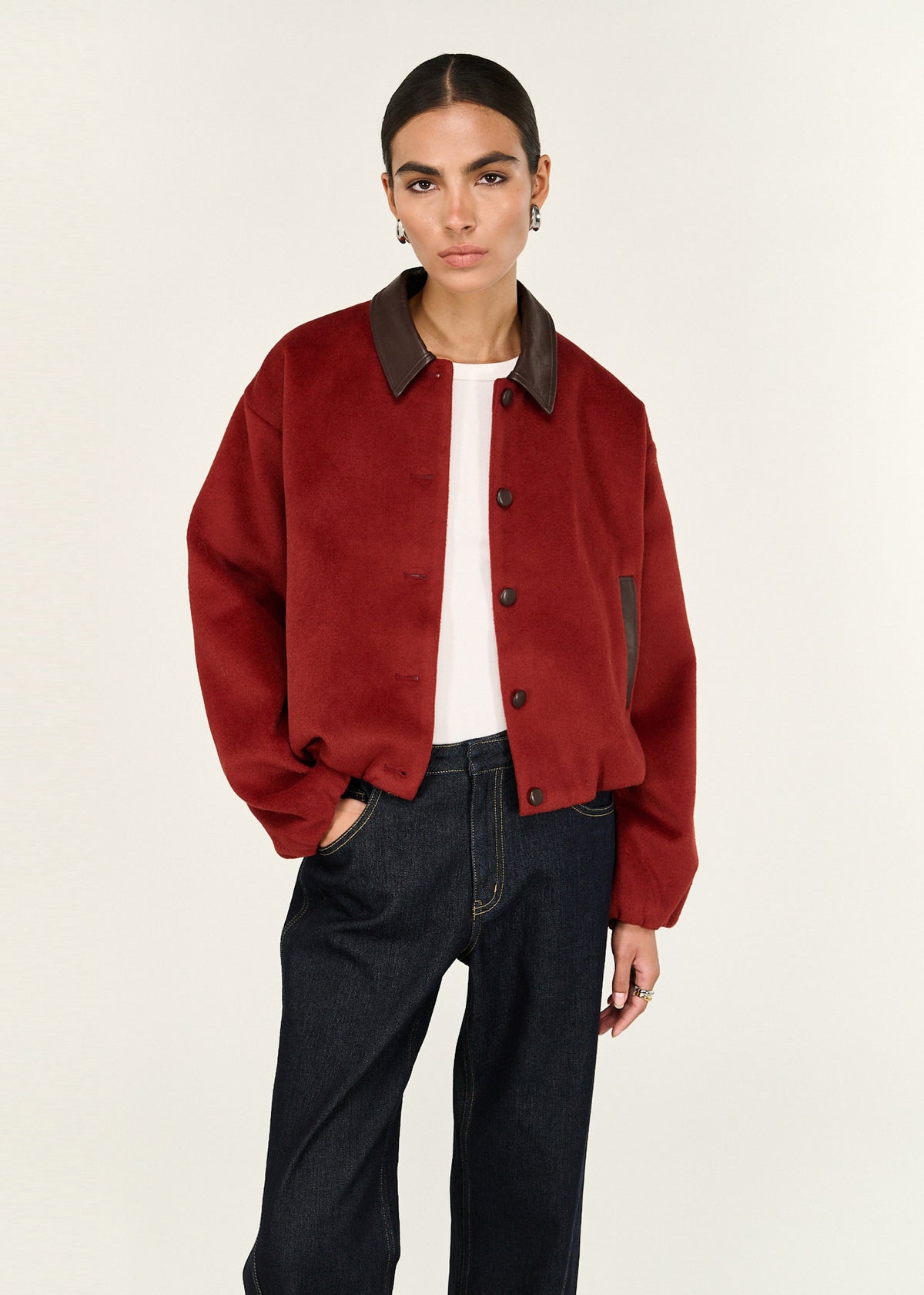 Close-up of the Burgundy Brushed Bomber Jacket, showing contrast trims and buttons.