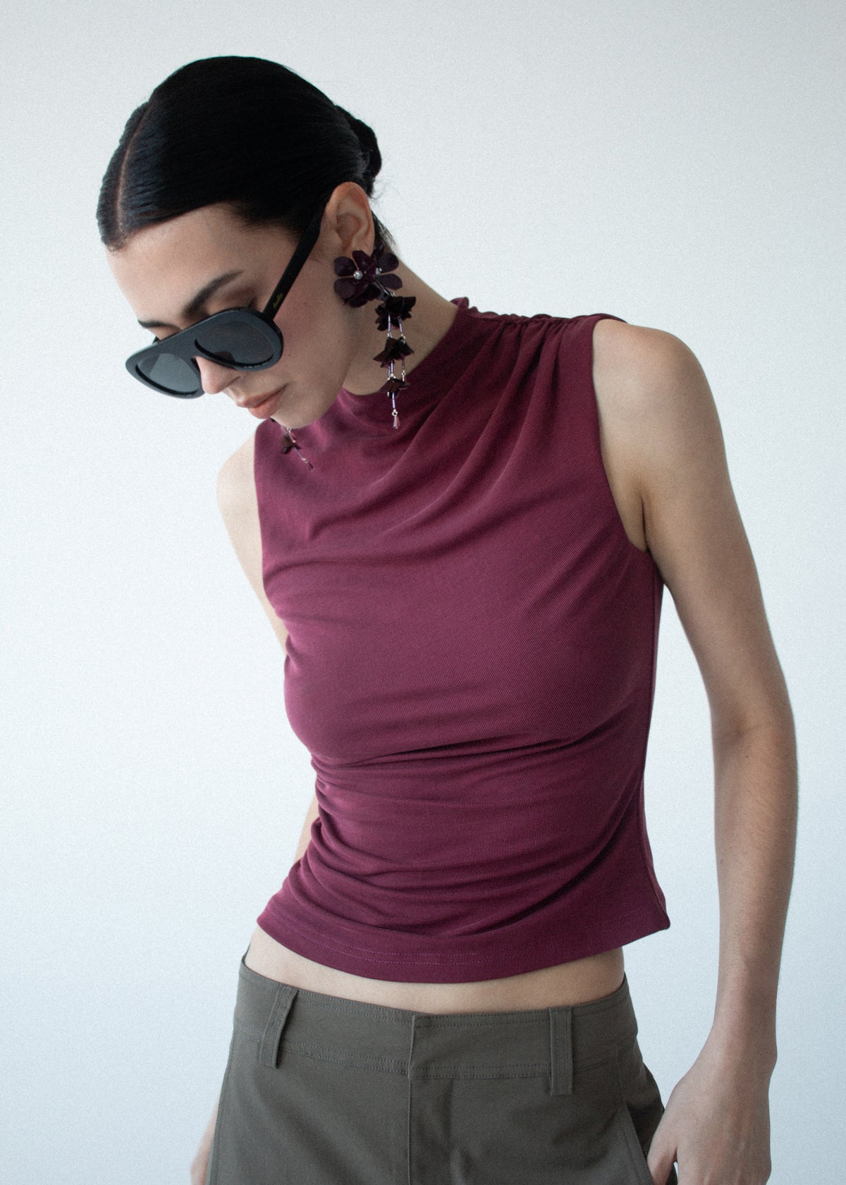 Close-up of Burgundy High Neck Ruched Jersey Top with a high neckline and a sleeveless cut.