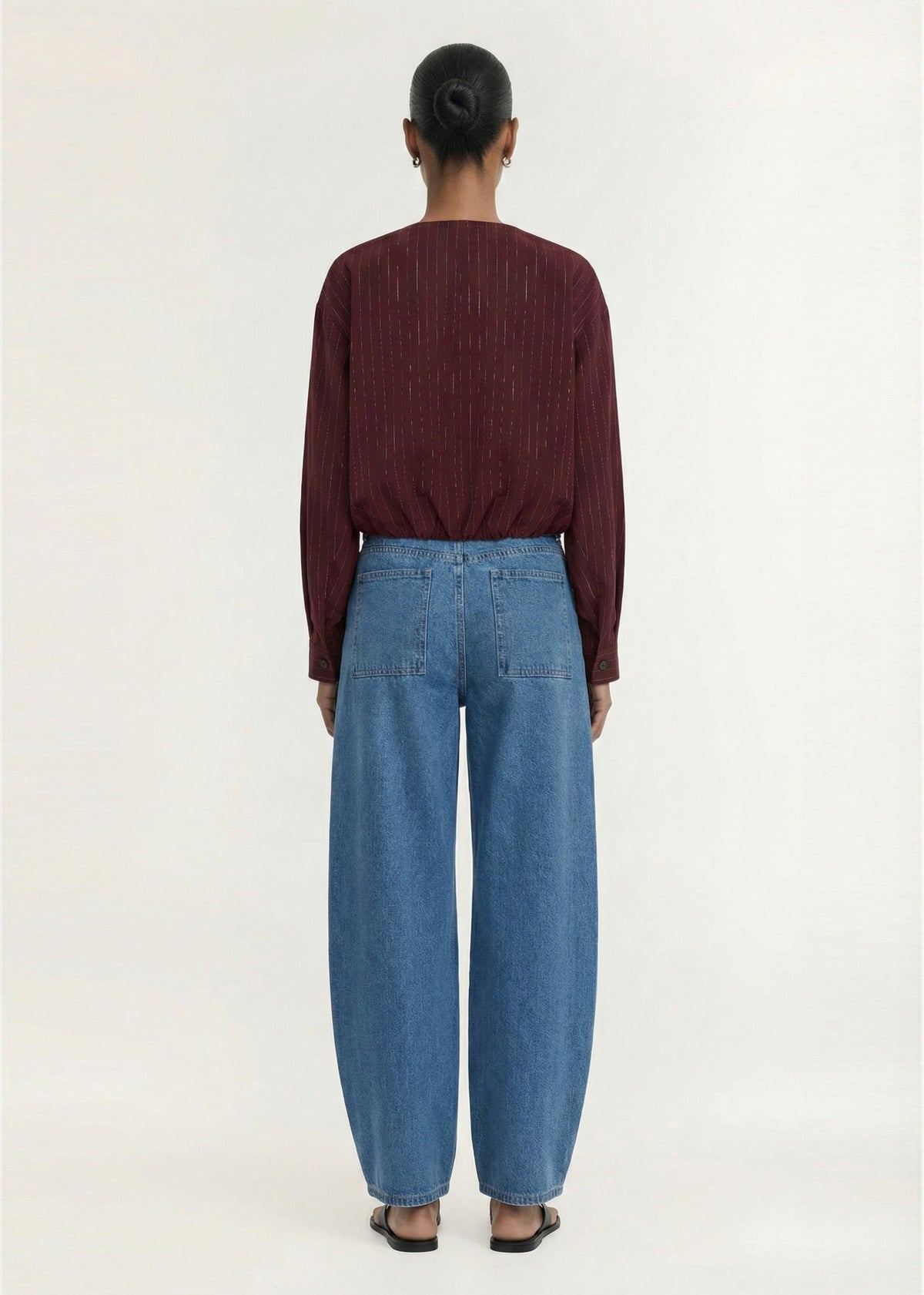 Back view of the Burgundy Pinstripe Cropped Jacket with a front button closure and a cropped silhouette.