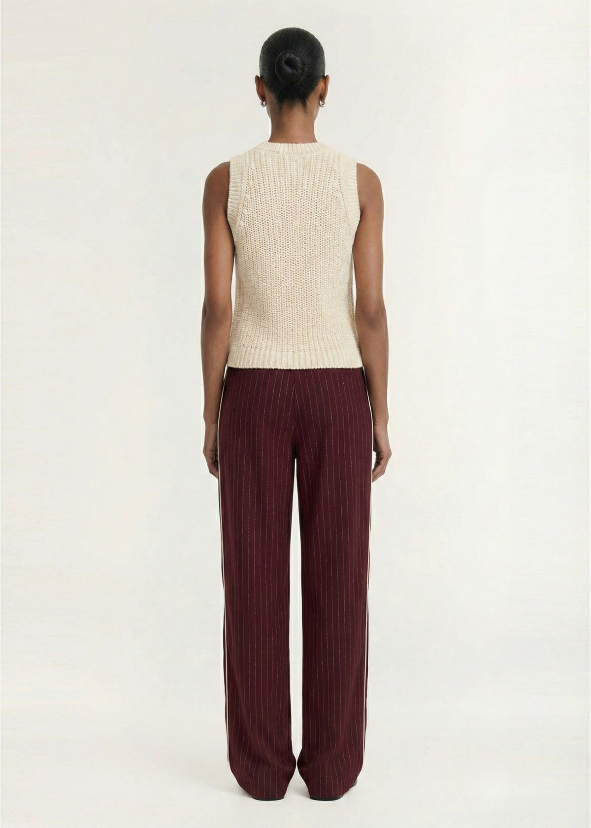 Back view of the Burgundy Pinstripe Relaxed Pant with a soft woven fabrication and a pinstripe design.