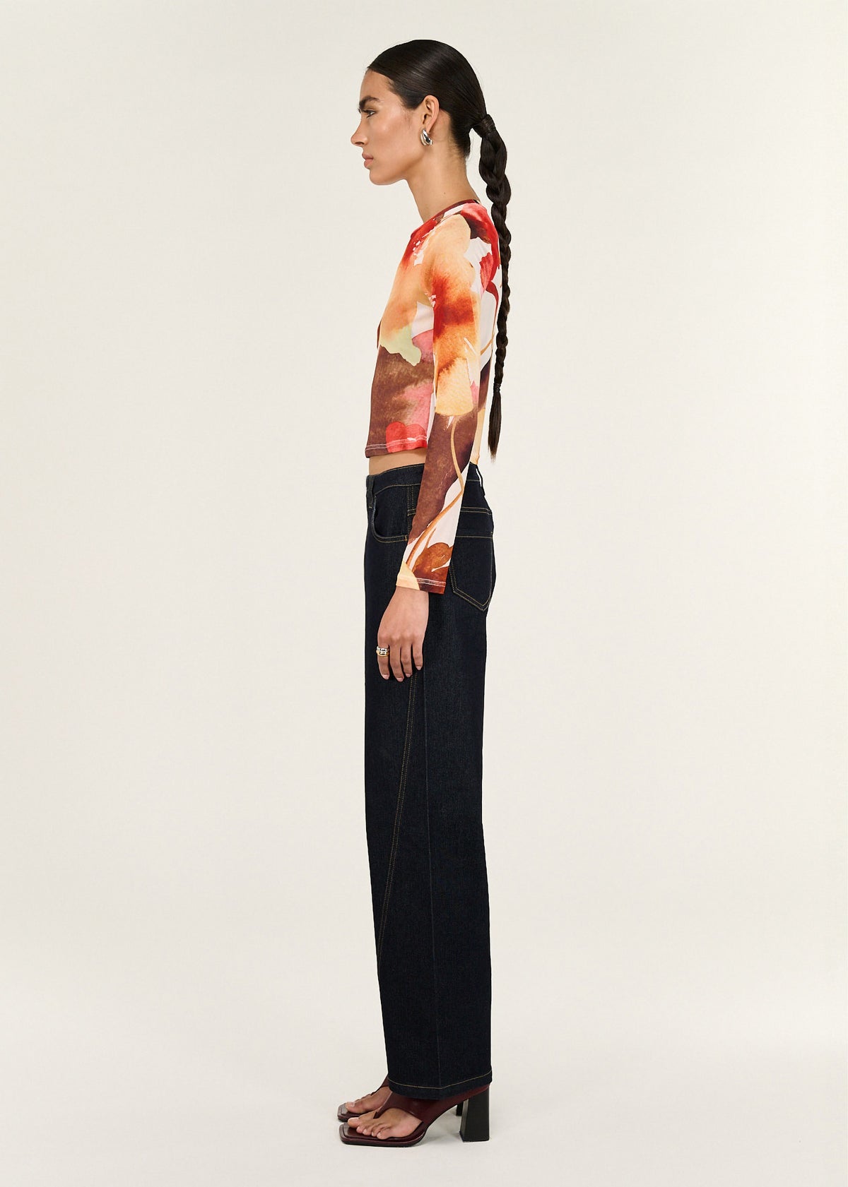 Side view of the Burnt Floral Long Sleeve Mesh Top, showing a sheer stretch mesh fabrication and a watercolour floral print.