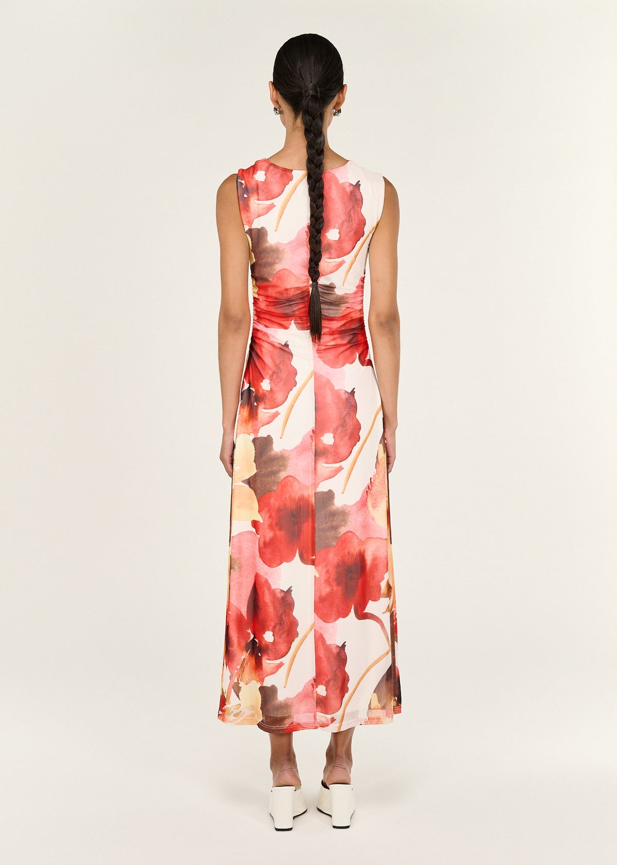 Back view of the Burnt Floral Mesh Midi Dress with a sleeveless silhouette and a gold hardware shoulder detailing.