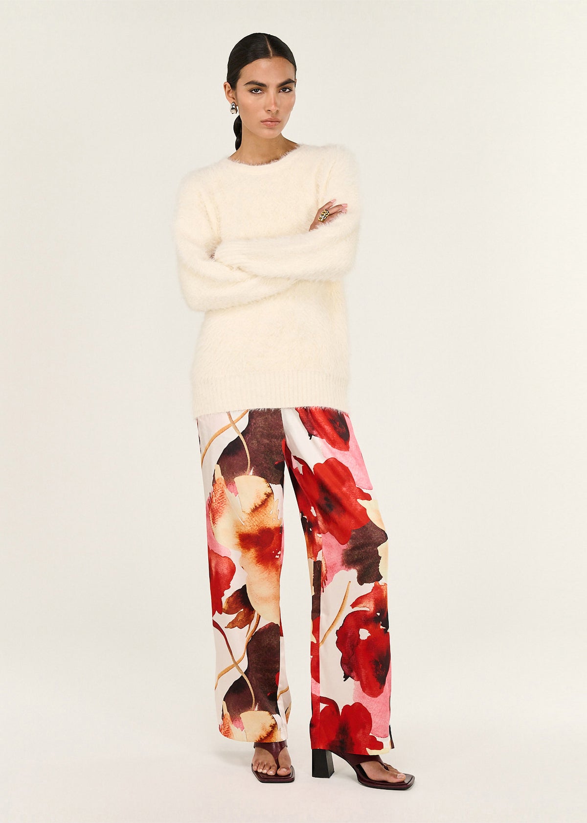 Model wearing Burnt Floral Silky Wide Leg Pants, showing an all-over abstract floral print and an elasticated waistband.
