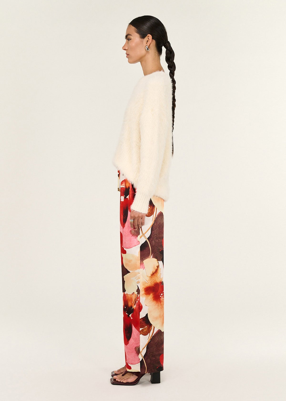 Side view of the Burnt Floral Silky Wide Leg Pants, showing an adjustable drawstring and a wide-leg silhouette.