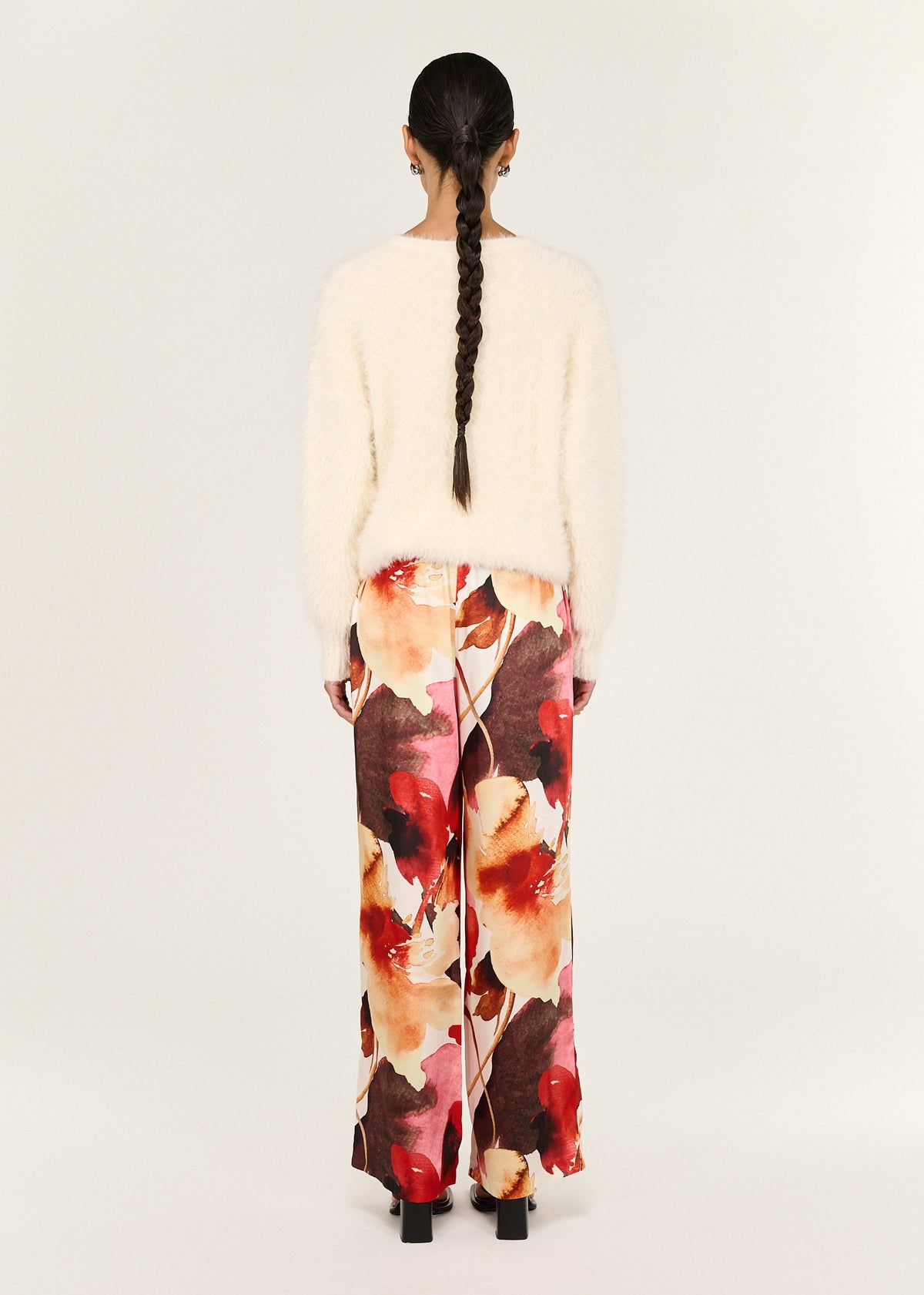 Back view of the Burnt Floral Silky Wide Leg Pants with an elasticated waistband and an adjustable drawstring.