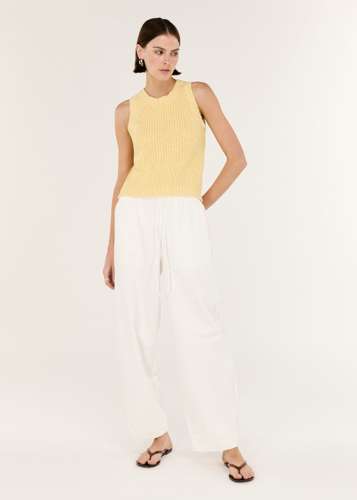 Model wearing Butter Yellow Cotton Blend Knit Tank, showing a relaxed yet refined fit.