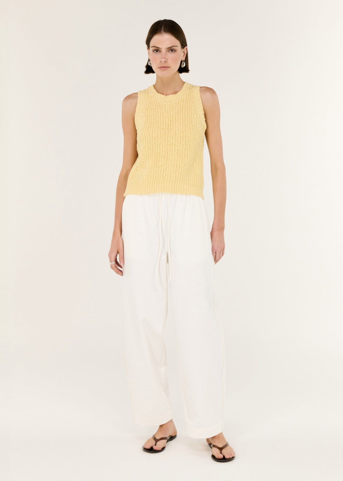 Model wearing Butter Yellow Cotton Blend Knit Tank with a midi length and a sleeveless cut.
