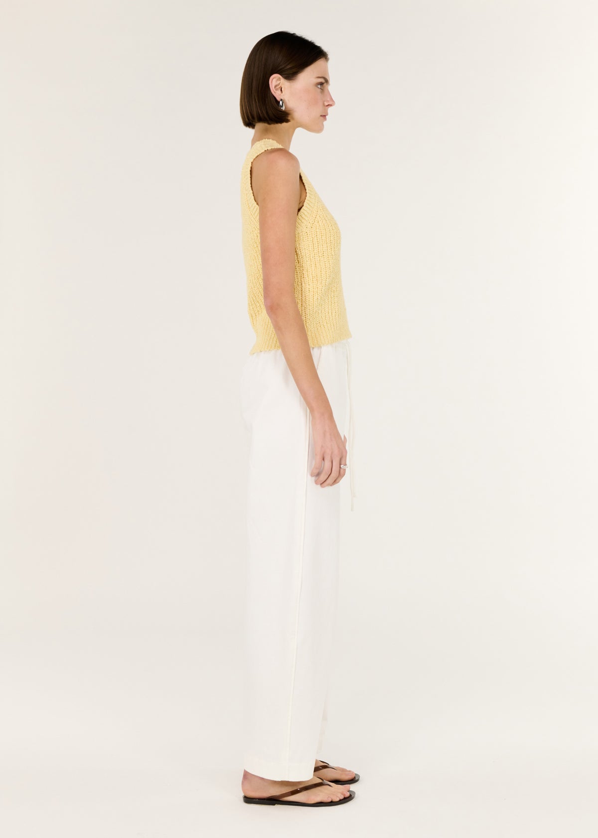 Side view of the Butter Yellow Cotton Blend Knit Tank, showing a ribbed neckline and hem.