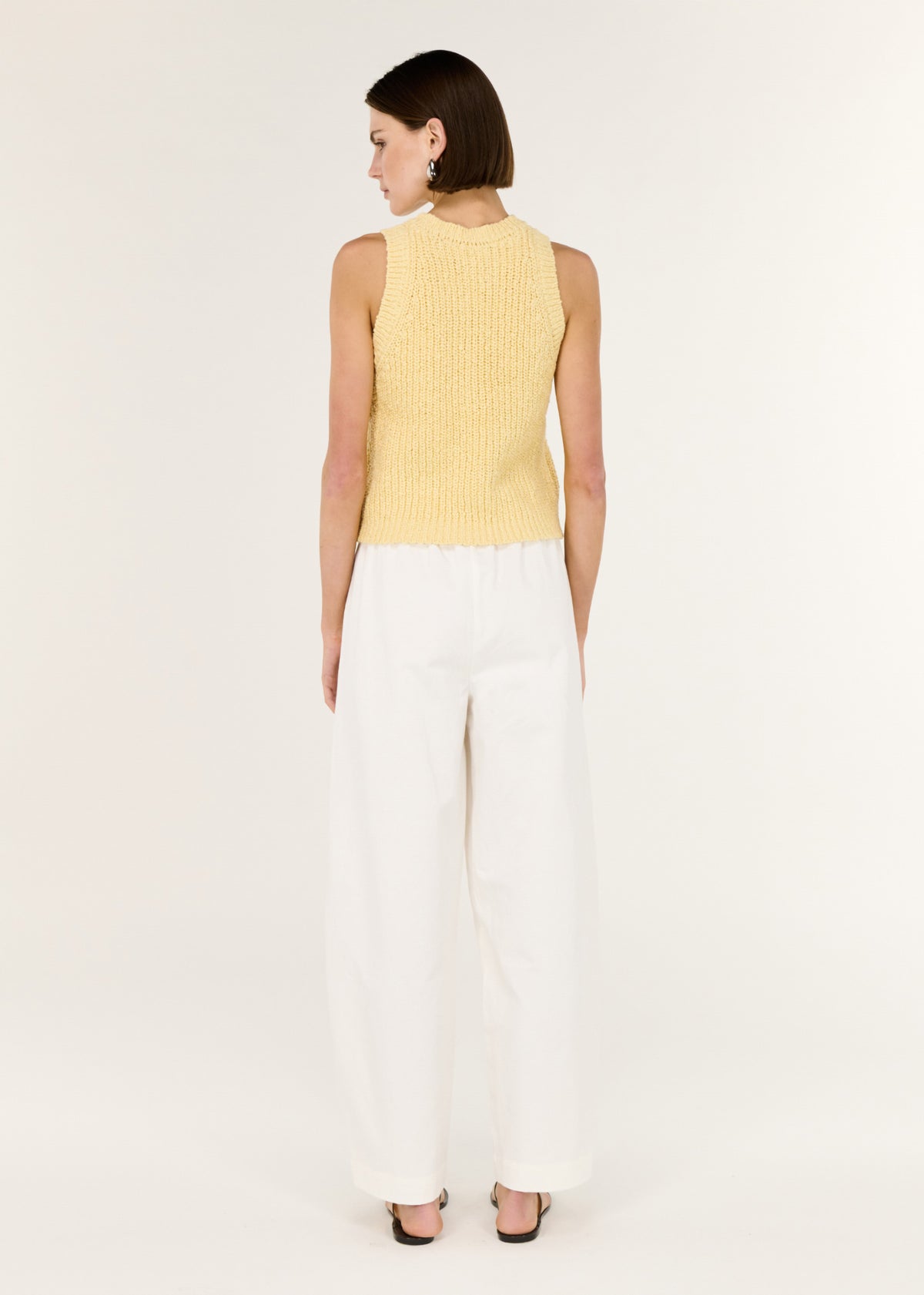 Back view of the Butter Yellow Cotton Blend Knit Tank with a sleeveless cut and a softly textured cotton-blend knit.