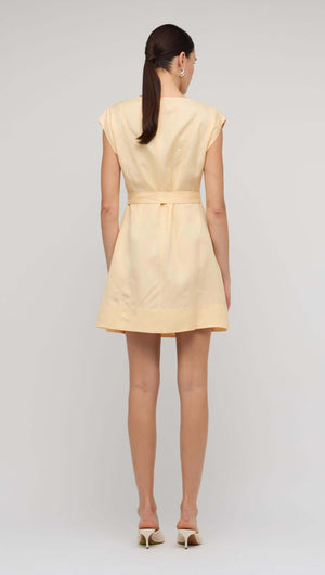 Back view of the Butter Yellow Linen Mini Dress showcasing its relaxed fit and self-tie belt.