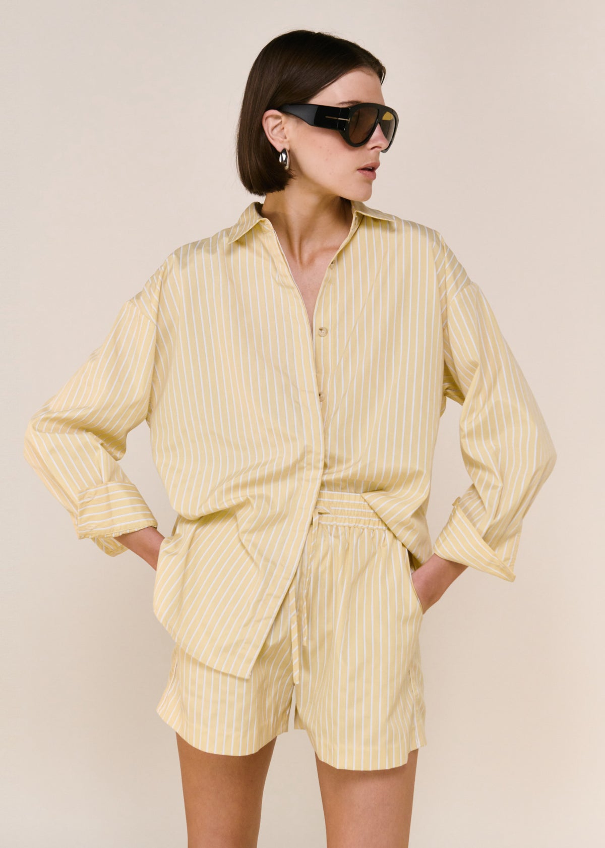 Close-up of the Butter Yellow Striped Shirt, showing long sleeves and a classic collar neckline.