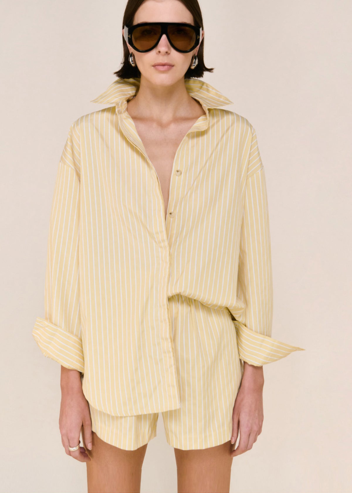 Close-up of Butter Yellow Striped Shirt with long sleeves and a classic collar neckline.
