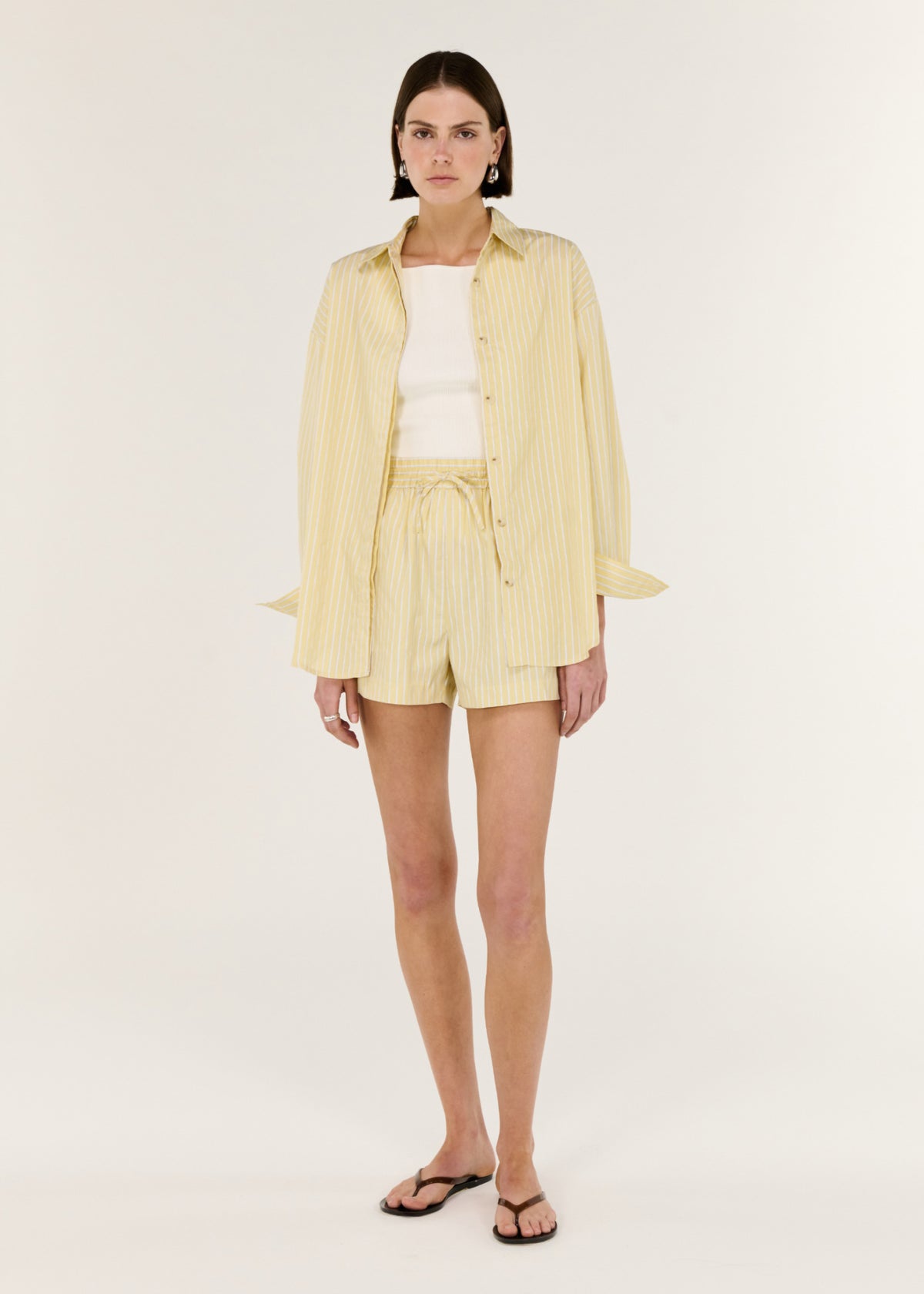 Model wearing Butter Yellow Striped Shorts with a comfortable waist design and a clean, minimal silhouette.