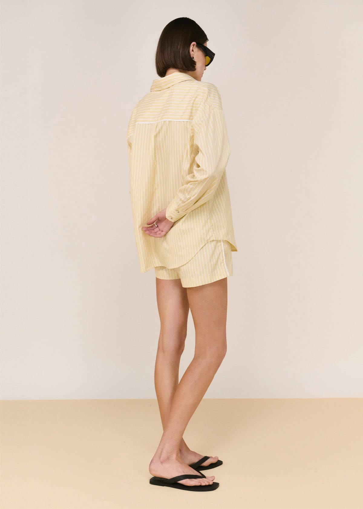 Back view of the Butter Yellow Striped Shorts with a comfortable waist design and a clean, minimal silhouette.